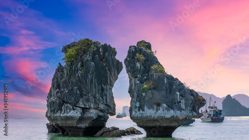 Hon Ga Choi Island or Cock and Hen, Fighting Cocks Island located in Halong bay, Vietnam, Trong Mai island, Southeast Asia, Junk boat cruise Ha Long Bay, Popular landmark, famous destination Vietnam.