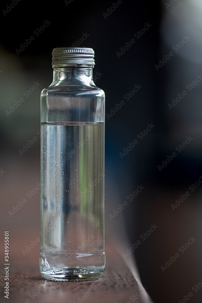 clear glas bottle with water
