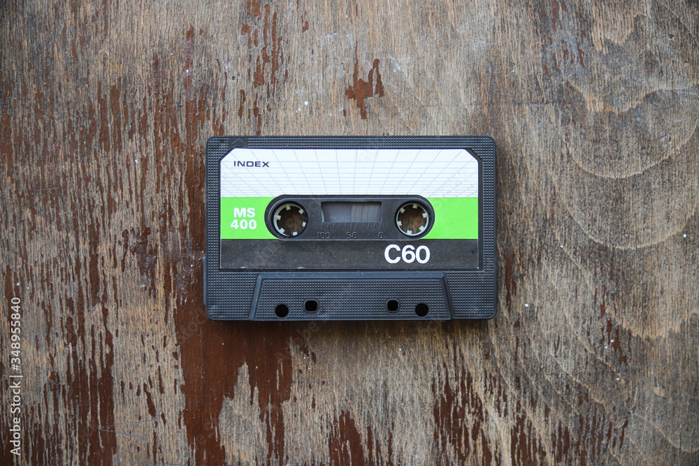 Obraz premium Old tape cassette, old or aged wood background. İsolated casette