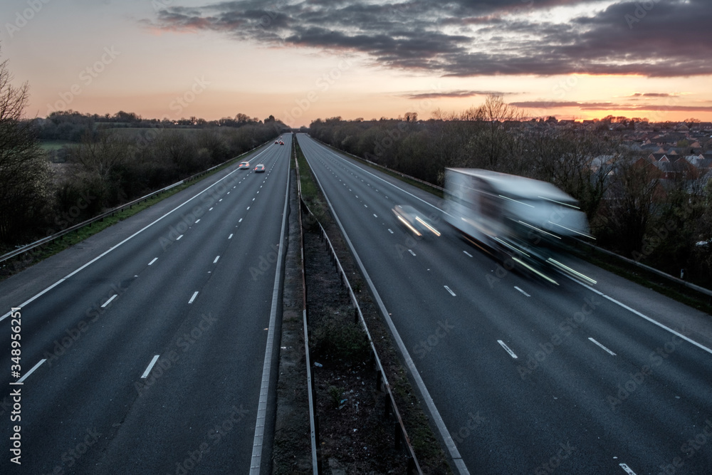 Fototapeta premium A motorway in the UK, during the Covid 19 lock down. It is early evening, during rush hour, and the motorway is almost deserted