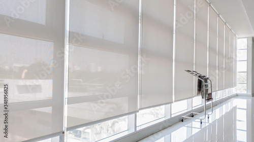 Newspaper rack corner in the office, Rayong, Thailand - Nov 15, 2019, Thailand interior decorated with newspaper rack corner beiside sunshade curtain in building, Sunproof curtain in office