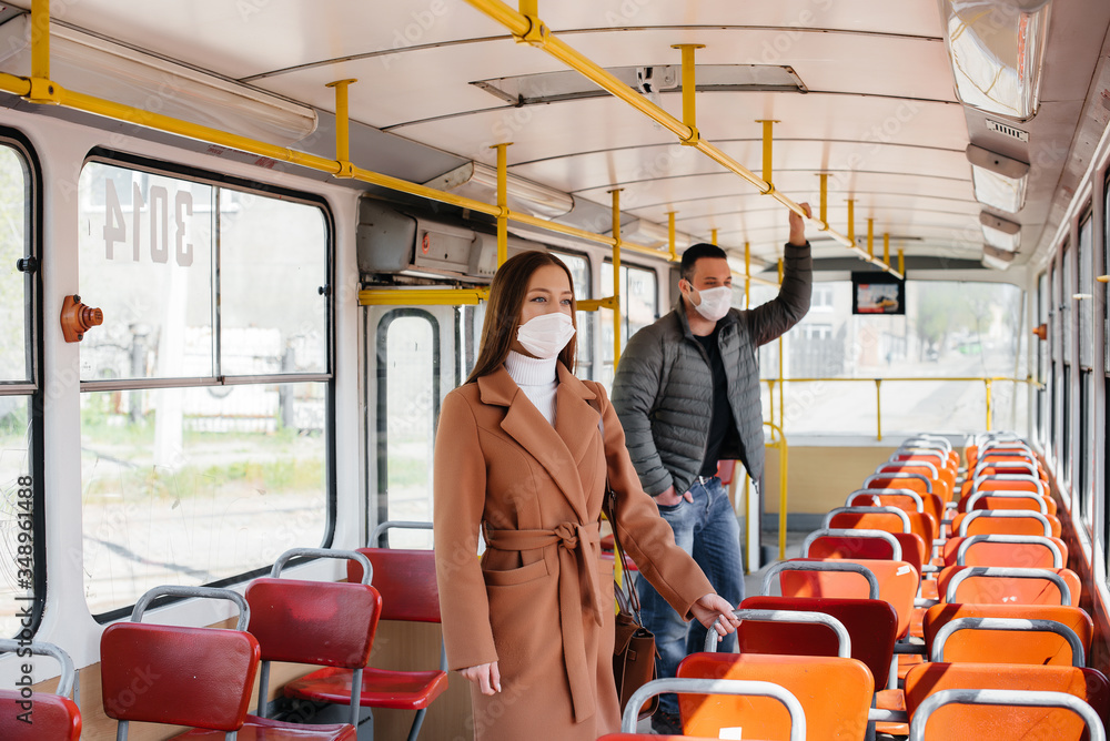 Fototapeta premium Passengers on public transport during the coronavirus pandemic keep their distance from each other. Protection and prevention covid 19