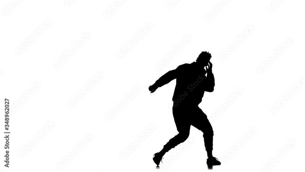 black silhouette on a white background, young energetic guy vigorously dancing hip hop, freestyle, street dance, performs complex movements, slow motion black silhouette on a white background, young energetic guy vigorously dancing hip hop, freestyle, street dance, performs complex movements, slow motion