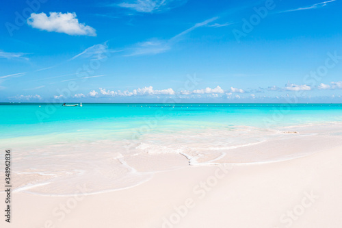 Sticker Idyllic tropical beach in Caribbean with white sand, turquoise ocean water and b