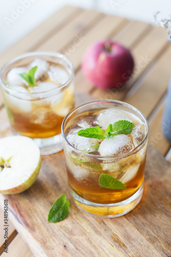 Close up glass with apple juice and mint