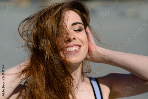 A close up of attractive young woman running