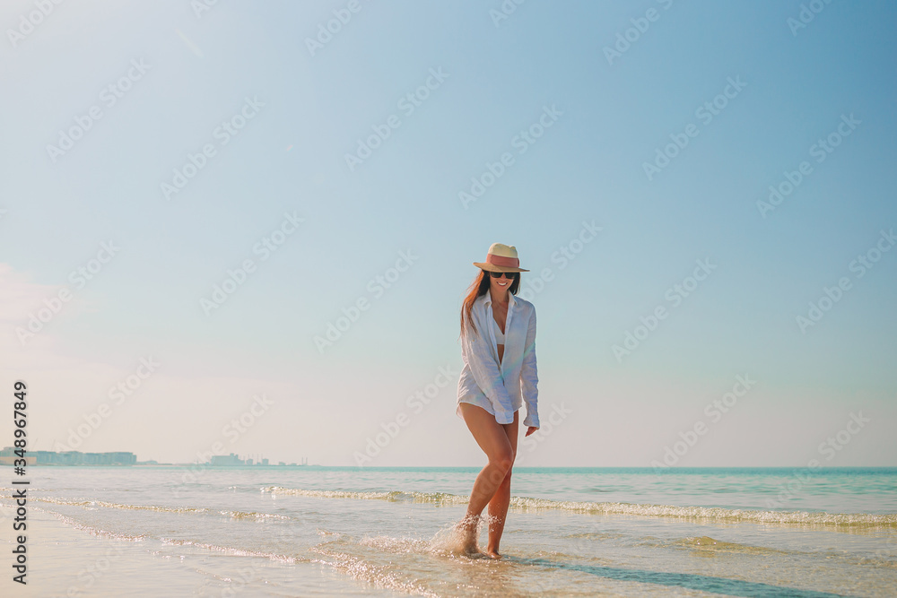 Woman laying on the beach enjoying summer holidays Woman laying on the beach enjoying summer holidays