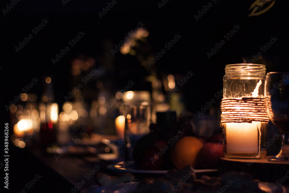 candle glass dark light table holiday night