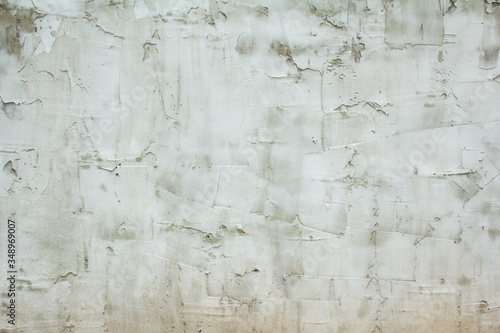 Grey concrete wall with fresh cement on rough surface texture background. © Purple Moon