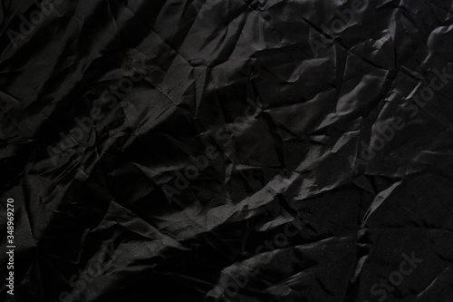 Crumpled black texture, crumpled black fabric, abstract background