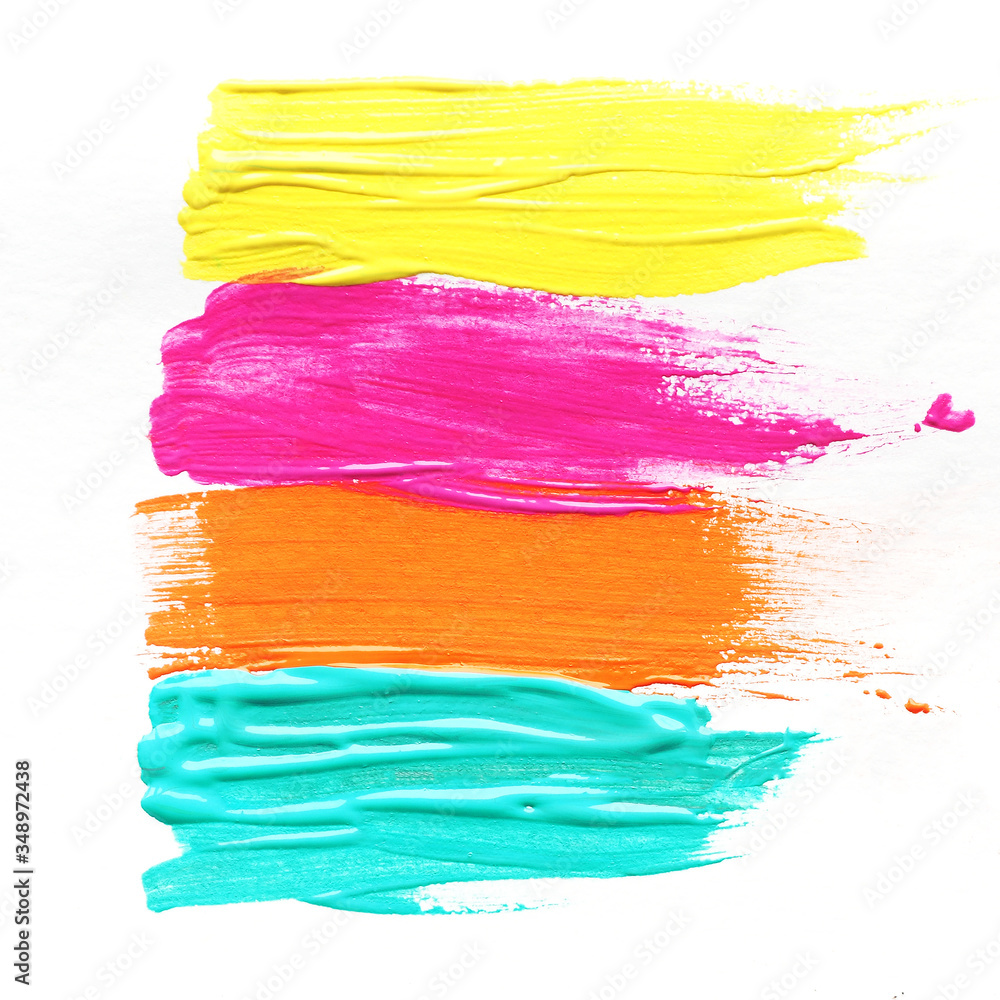 four bright strokes of yellow, pink, blue and orange paint. isolate on a white background. square format. four bright strokes of yellow, pink, blue and orange paint. isolate on a white background. square format.
