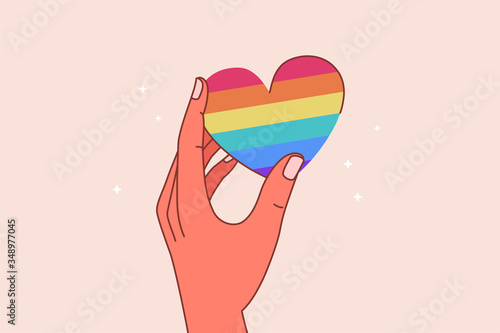 Vector illustration in flat simple linear style - hand and pride LGBT rainbow heart - lesbian gay bisexual transgender love concept