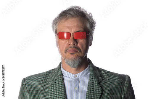 portrait of an elderly bearded man in sunglasses