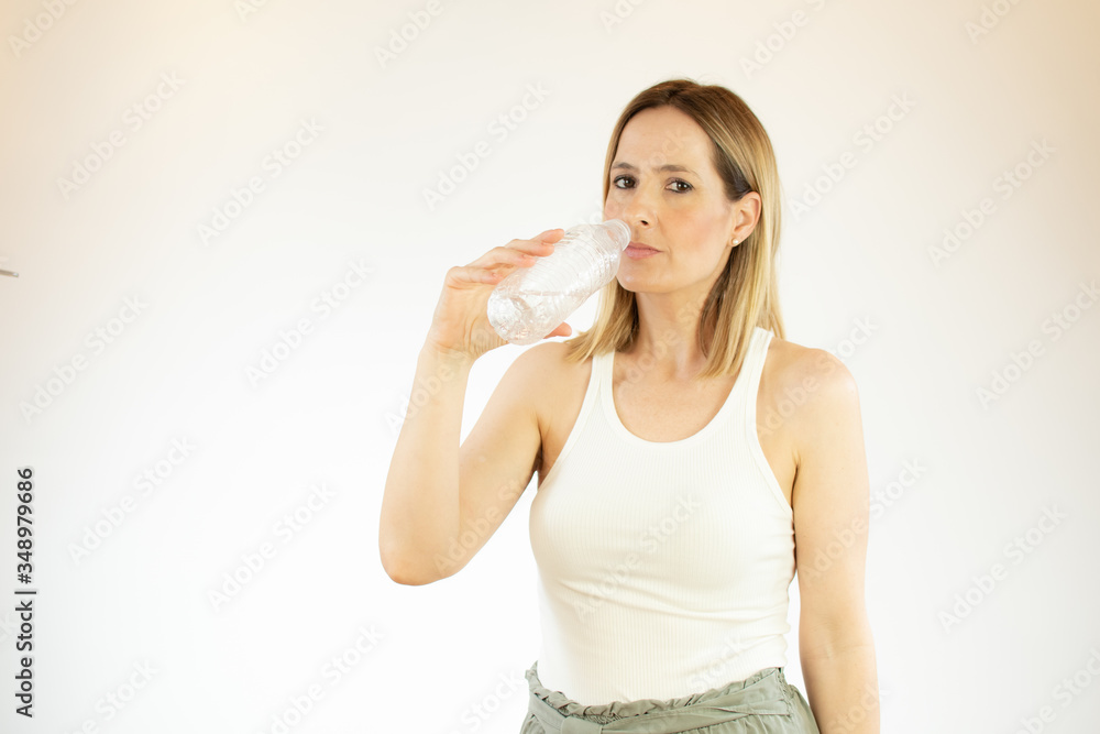 Beautiful woman making gesture of drinking water Beautiful woman making gesture of drinking water