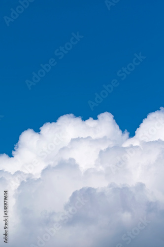 Clouds of cumulus clouds on a blue sky