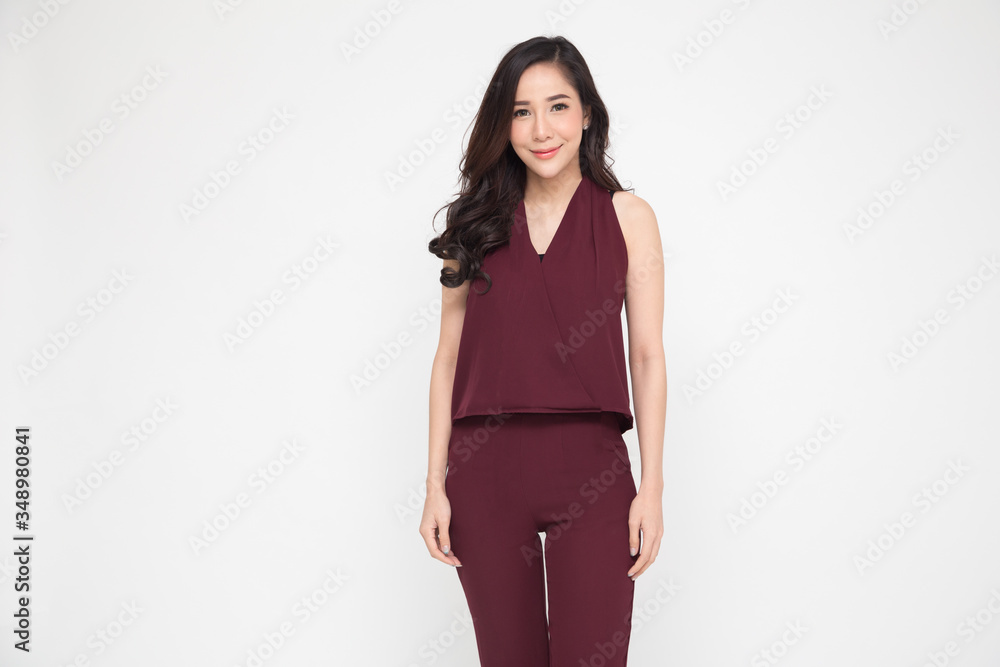 Portrait of a Asian charming businesswoman standing and looking at camera isolated over white background Portrait of a Asian charming businesswoman standing and looking at camera isolated over white background
