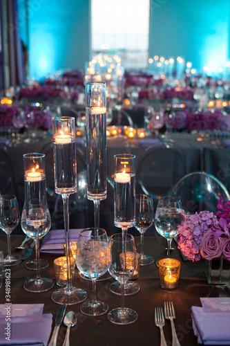 High angle vertical empty shot of table setting at a formal party at dusk. photo