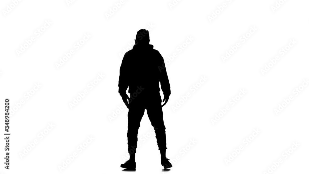 black silhouette on a white background, young energetic guy vigorously dancing hip hop, freestyle, street dance, performs complex movements, slow motion black silhouette on a white background, young energetic guy vigorously dancing hip hop, freestyle, street dance, performs complex movements, slow motion
