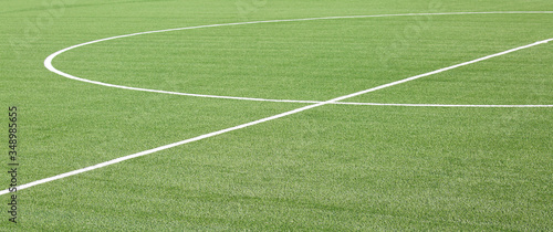 green lawn with the white lines of the playing field made with c