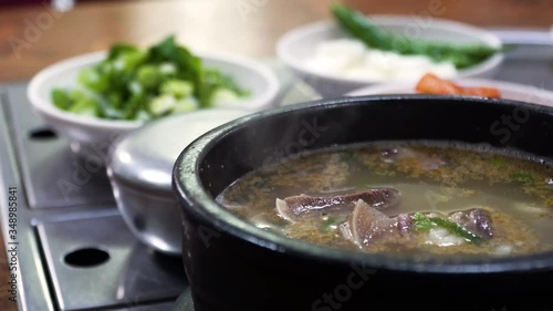 Someori(cow's head) gukbab is korea traditional meal beef soup with steam rice photo