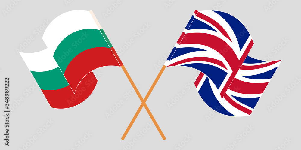 Crossed and waving flags of Bulgaria and the UK