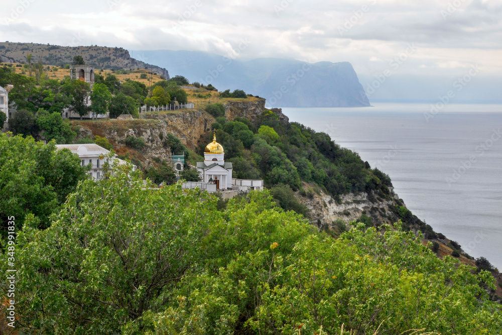 Naklejka premium Monastery on the slope by the sea