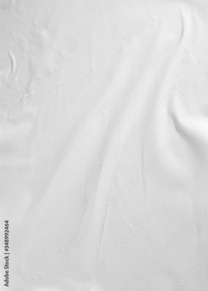 Obraz premium Glued paper for poster texture. Blank white crumpled and wrinkled paper template for background. Matted wet paper wrinkled for mockup posters