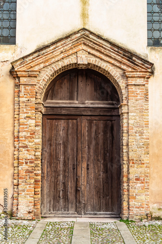 View on the entrance of the church of San Martino in the village of Este in the province of Padua, Veneto - Italy © REDMASON