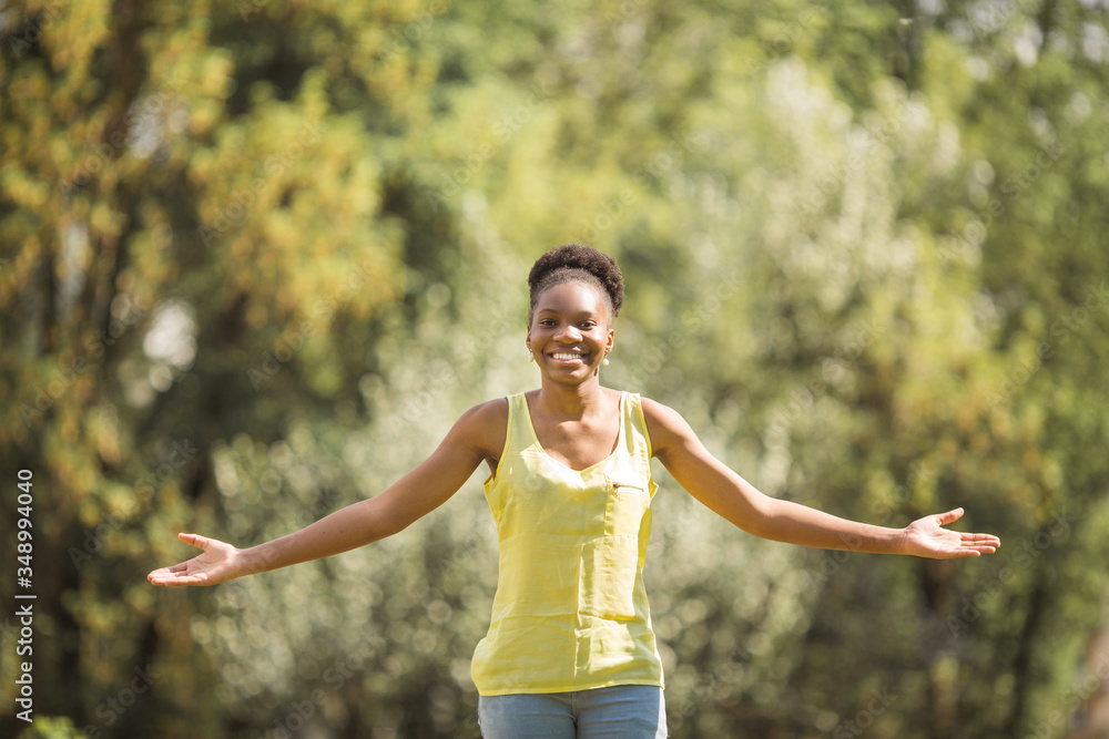beautiful young african woman in summer park beautiful young african woman in summer park