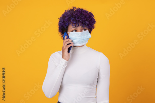 woman or girl with face mask isolated on color background © carballo