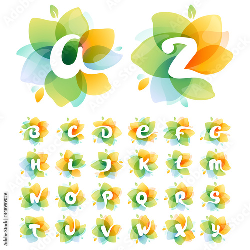 Alphabet at colorful watercolor flower.
