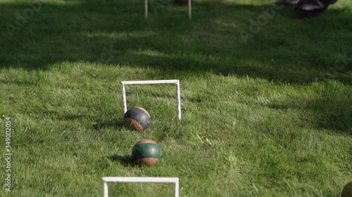 Men in business suits play croquet photo