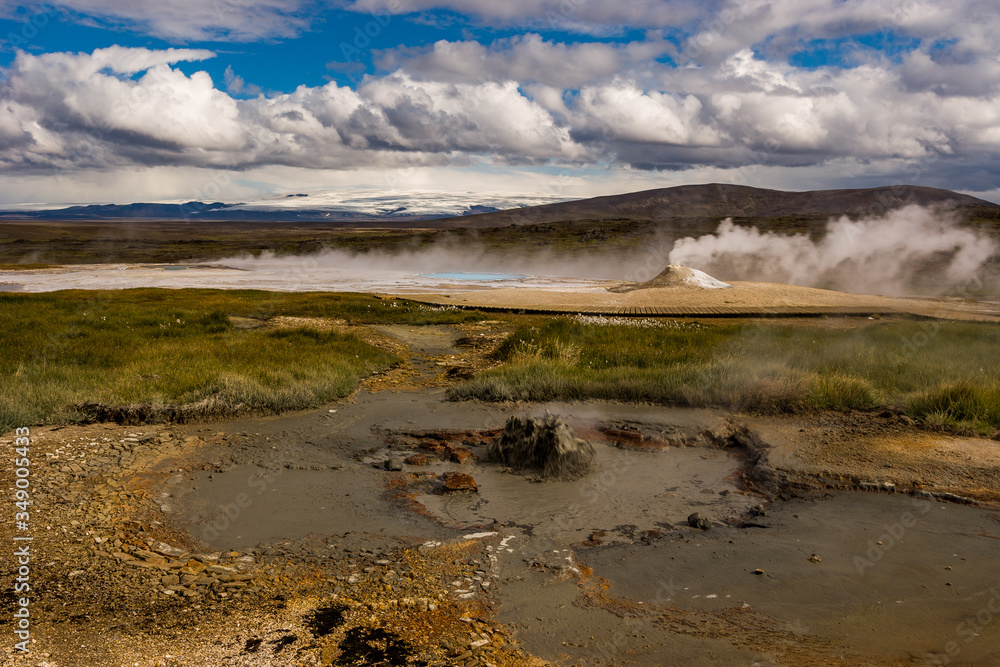 Beautiful colourful Icelandic landscape lava fields mountain geysers zigzag road and moss-covered stones Namafjall, Iceland.