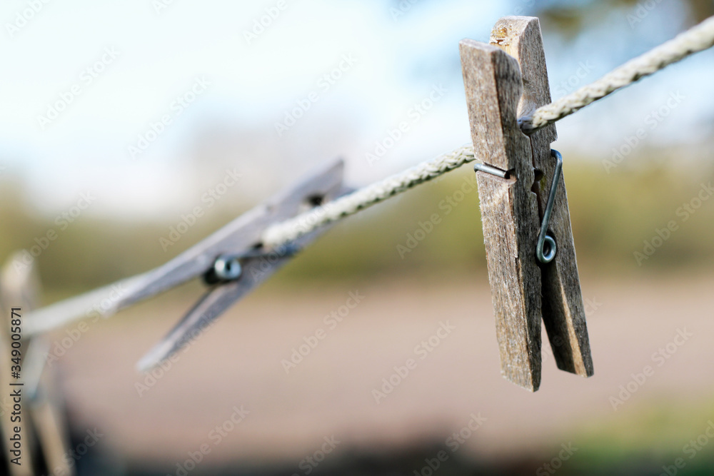 Obraz premium old wooden clamps on clothesline