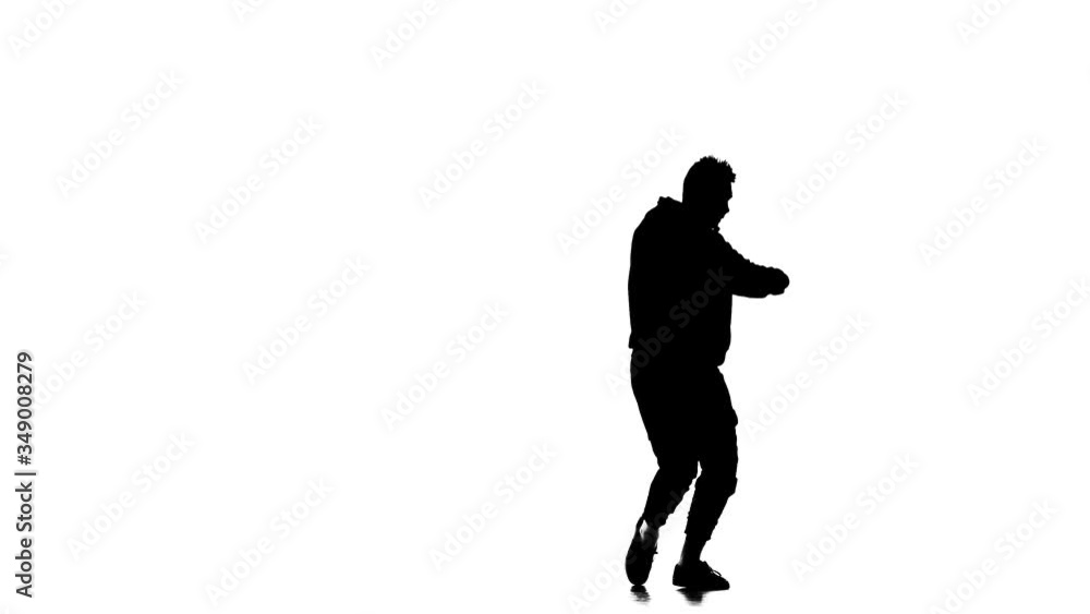 black silhouette on a white background, young energetic guy vigorously dancing hip hop, freestyle, street dance, performs complex movements, slow motion black silhouette on a white background, young energetic guy vigorously dancing hip hop, freestyle, street dance, performs complex movements, slow motion