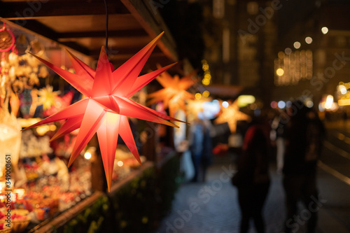 Christmas stars in a sale booth on a historic xmas market in Bremen, Germany with blurry Background and no people photo