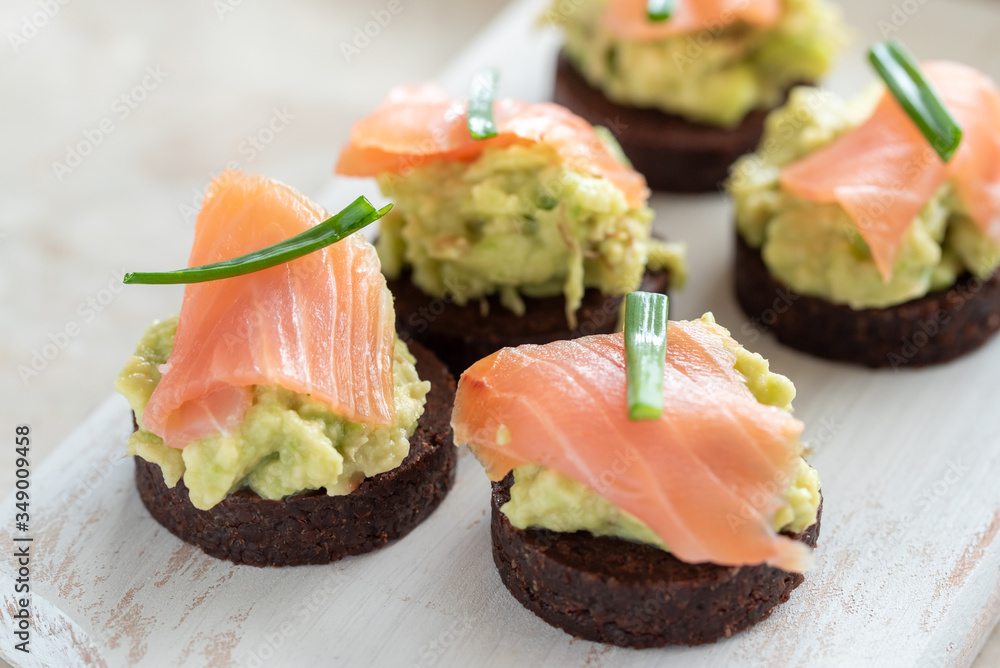 Avocado paste with salmon on wholemeal bread Avocado paste with salmon on wholemeal bread