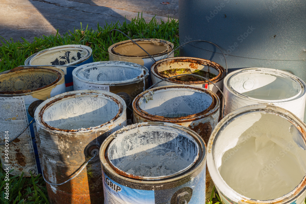 Empty paint cans at the curb for recycle pick-up Empty paint cans at the curb for recycle pick-up