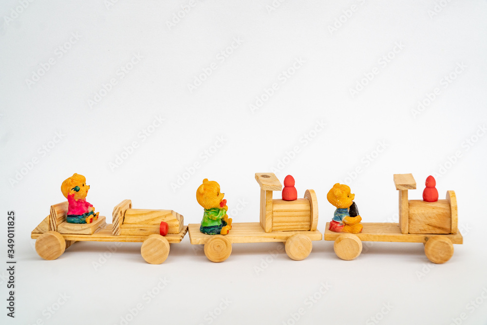 Wooden train, a toy, isolated on white. Yellow wooden toy train