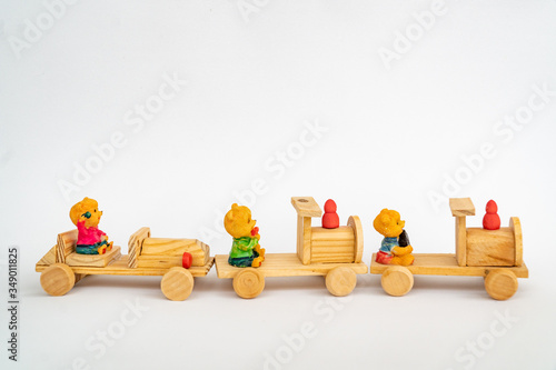 Obraz na płótnie Wooden train, a toy, isolated on white. Yellow wooden toy train w salonie