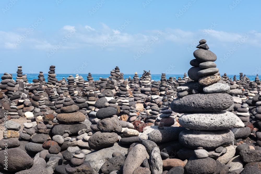 Stone cairns on Puerto de la Cruz coast, Tenerife island, Spain Stone cairns on Puerto de la Cruz coast, Tenerife island, Spain