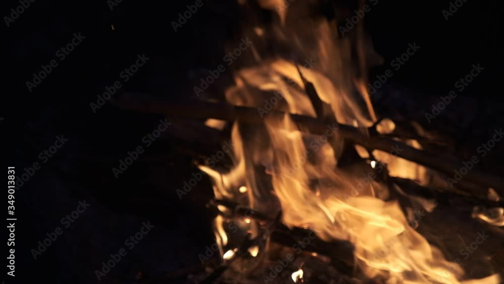 Red-orange flames of a burning fire. Red-orange flames of a burning fire.
