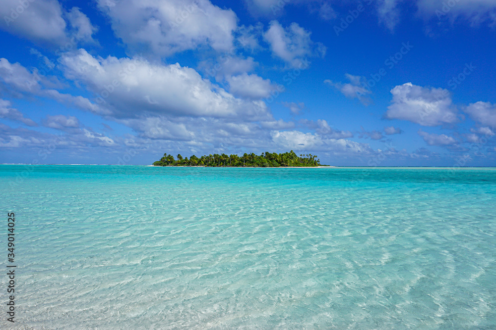 tropical island in turquoise ocean in cook islands