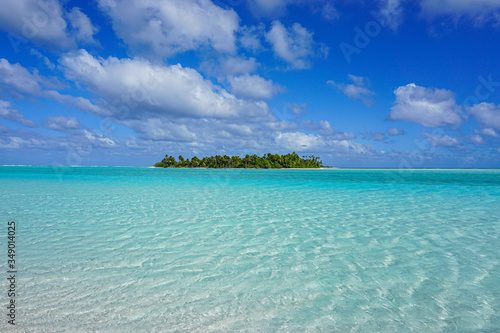tropical island in turquoise ocean in cook islands