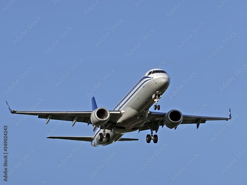 MOSCOW , RUSSIA, June 10, 2019: The Commercial passenger airplane flying overhead on sunny day on June 10, 2019 in Moscow, Russia MOSCOW , RUSSIA, June 10, 2019: The Commercial passenger airplane flying overhead on sunny day on June 10, 2019 in Moscow, Russia