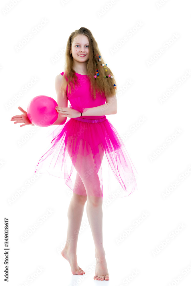 Girl gymnast performs exercises with the ball. Girl gymnast performs exercises with the ball.