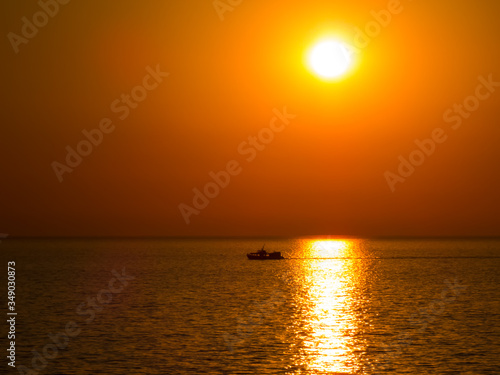 Ship at sea in the sunset