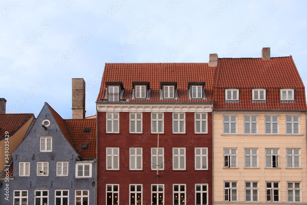 Partial view of the colorful facades of the typical buildings in front of the Nyhavn canal in Copenhagen. Postcard concept