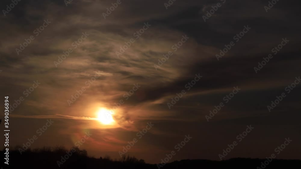 Time lapse amazing sunset shining through soft clouds going to darkness. 4K Time lapse amazing sunset shining through soft clouds going to darkness. 4K