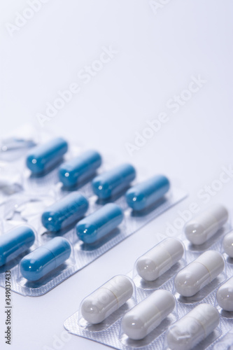 orange pill tablet container lying on grey and silver treatment packages scattered health cure vaccine  © MS Photography